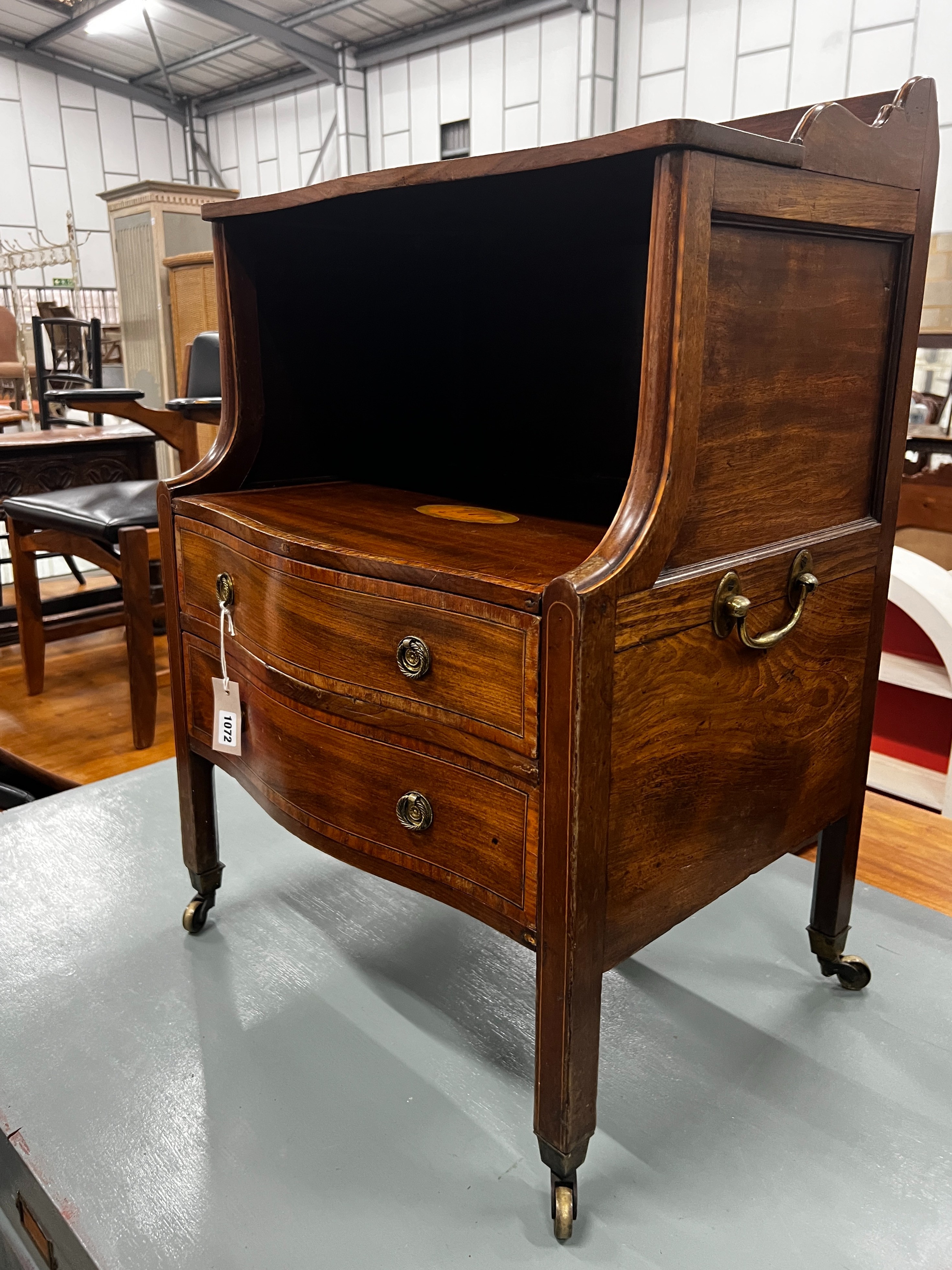 A George III inlaid mahogany serpentine front bedside chest, width 55cm, depth 42cm, height 80cm